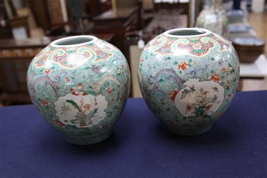 A pair of Chinese famille verte ovoid jars and covers, late 19th century, 31cm, one cover repaired